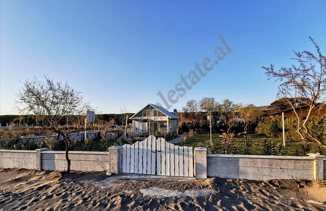 Land for sale with a wooden house in Velipoja Beach in Albania. The land is located in Pulaj on the 